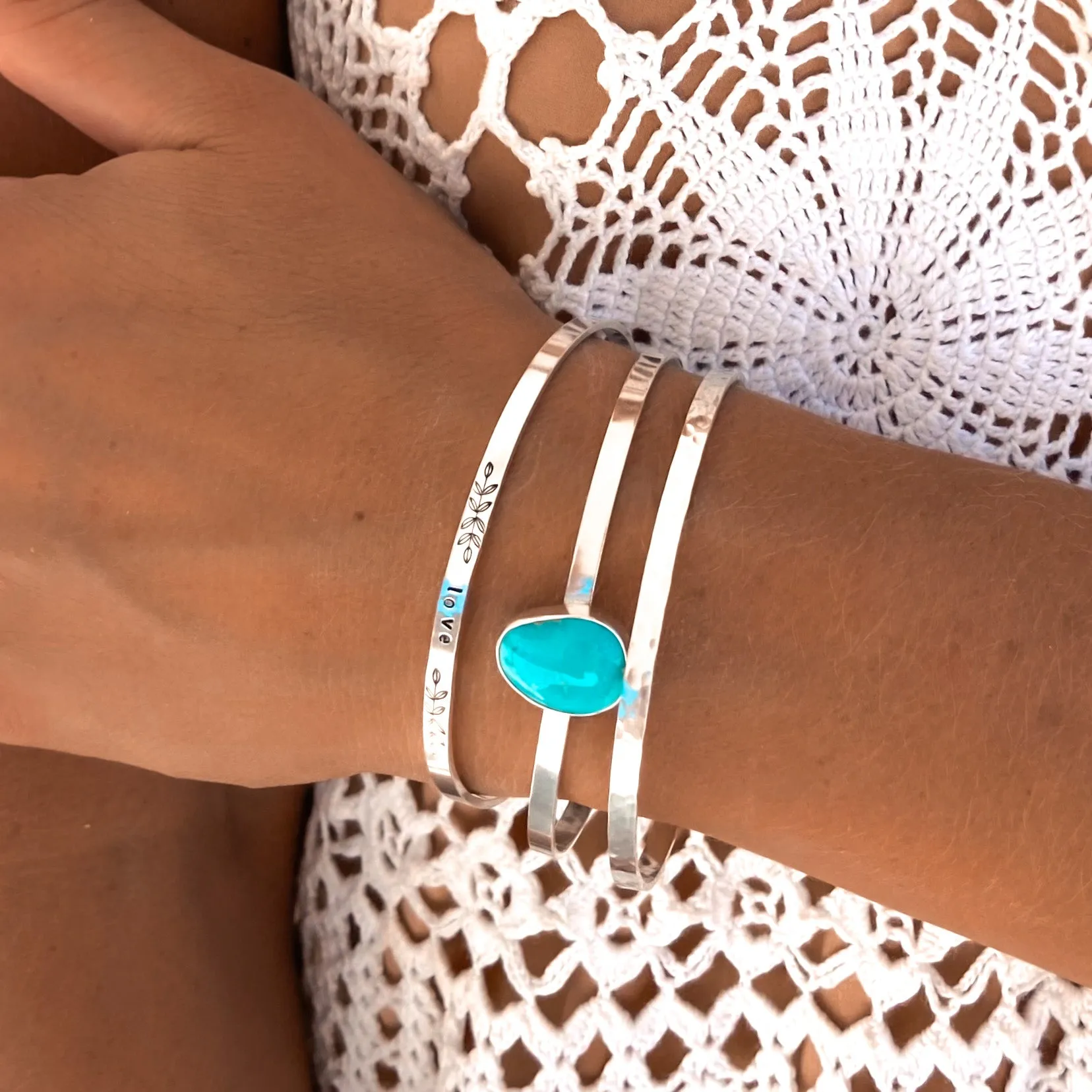 Blue turquoise "love" cuff set in silver